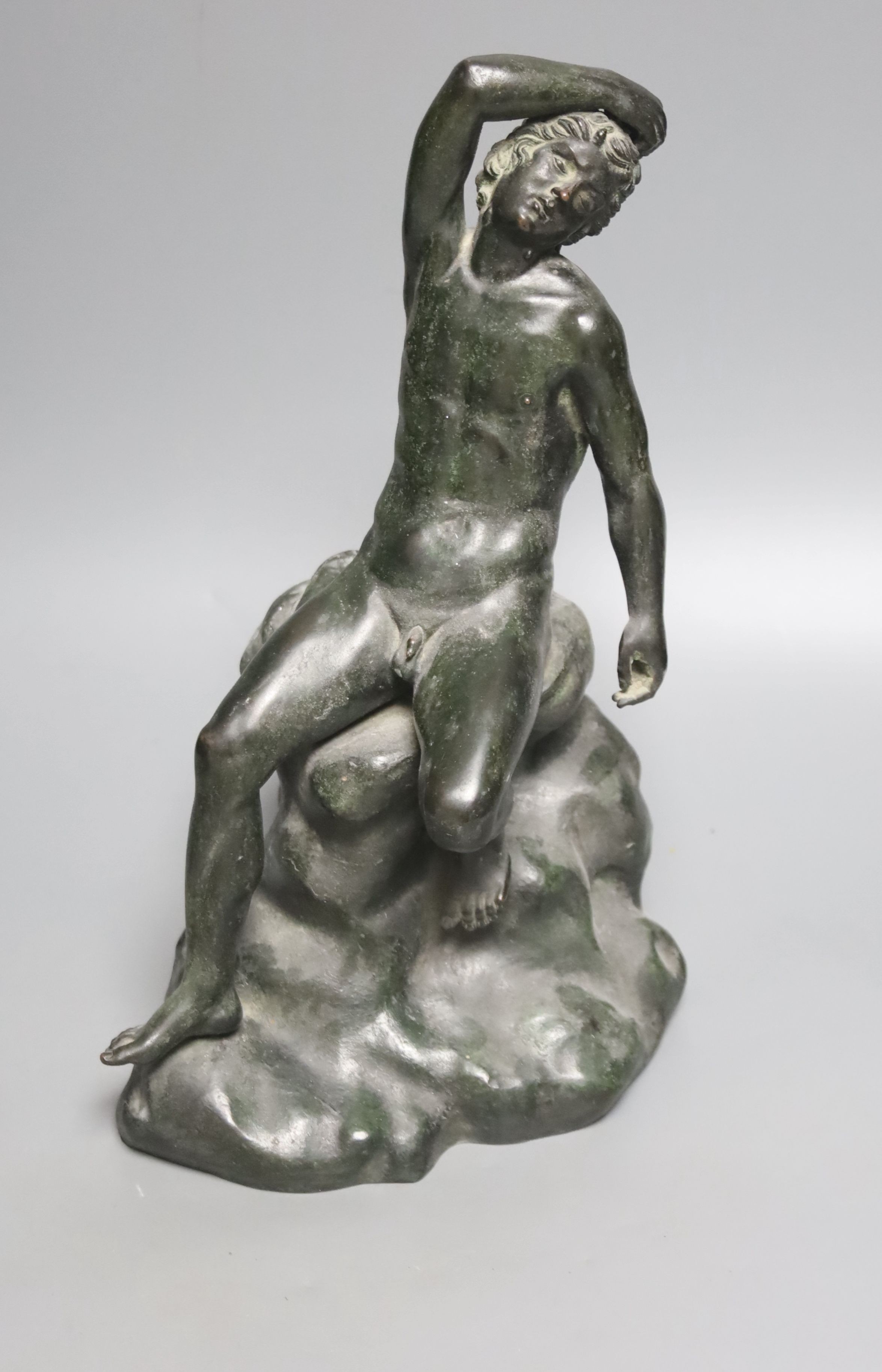 After the Antique a bronze figure of a man seated on a rock, height 34cm